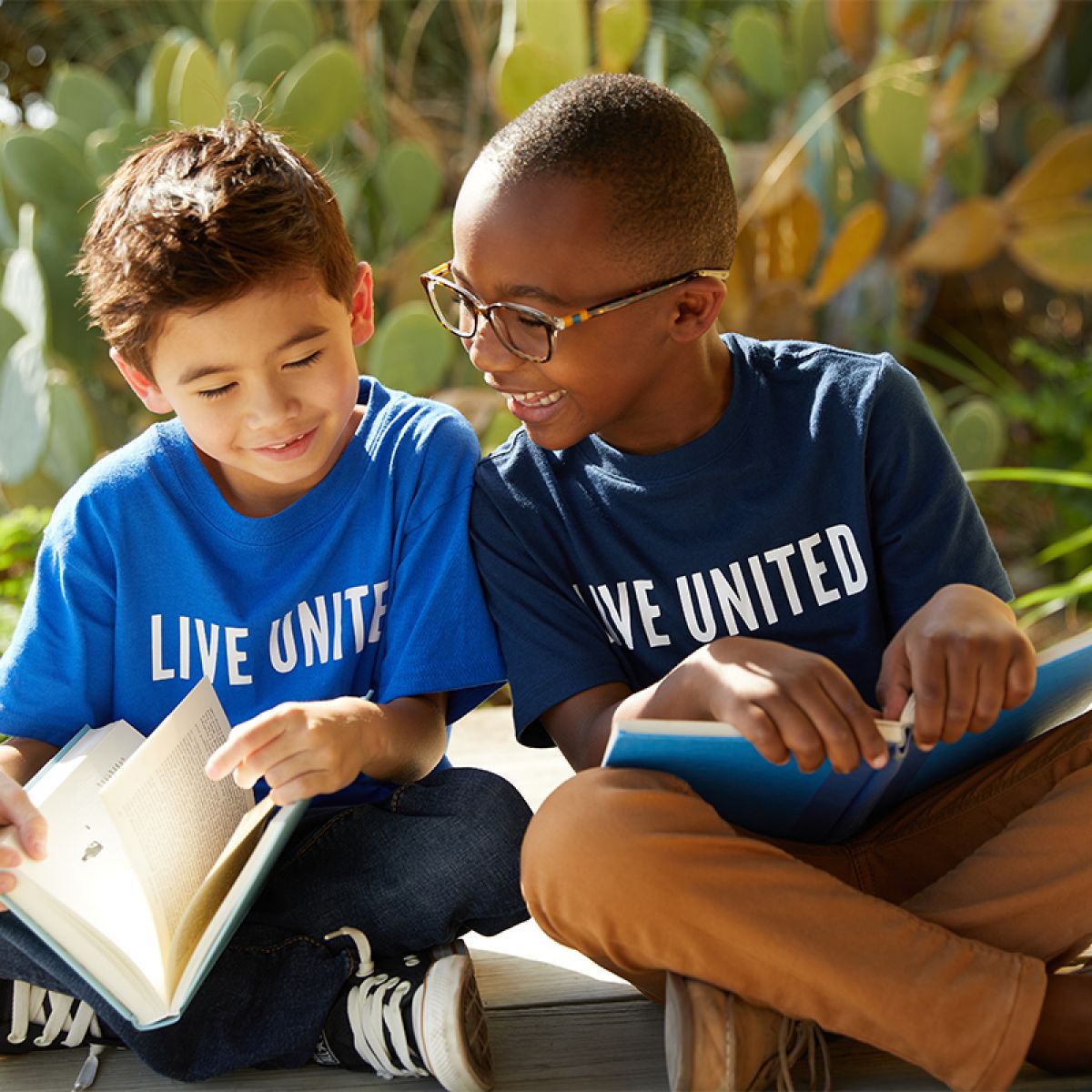 two boys reading books
