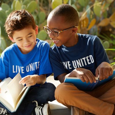 two boys reading books