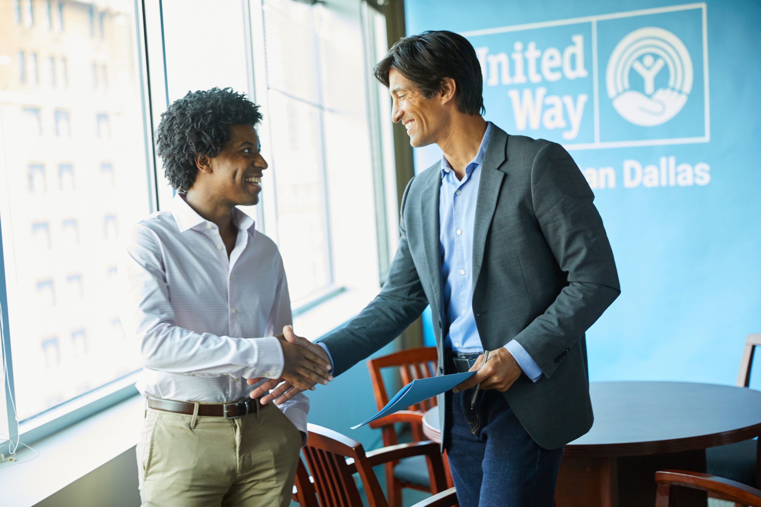 woman shaking mans hand, employment opportunity