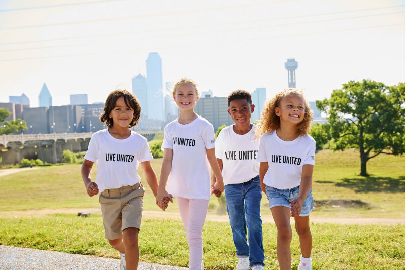 young volunteers take canned goods to destination