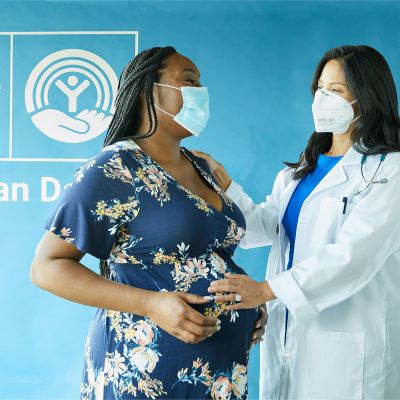 doctor is with pregnant woman